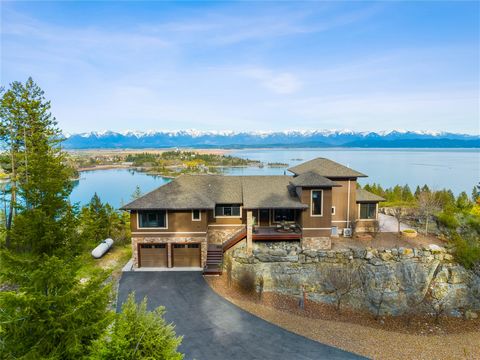 An awe inspiring setting with iconic panoramic Flathead lake and mountain views, this 4 Bed-3 Bath, contemporary home has end-of-road privacy, sits on over 2.40 acres, and has room to add a guesthouse or shop. This exquisite, fully furnished home has...