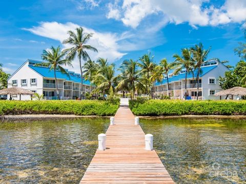 By the Sea in South Sound is a charming beachfront retreat with 3 bedrooms. The interior features a blend of contemporary design and tropical elements, with a spacious living area that boasts large windows for ample natural light. The bedrooms are de...