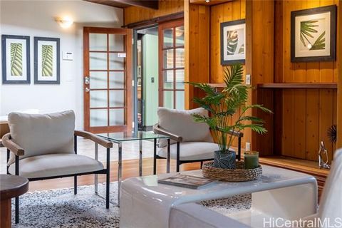 Discover this custom-designed single-story gem in Keolu Hills, radiating a classic Hawaiian home feel. This 4-bedroom, 3-bathroom residence blends timeless charm with modern amenities. The home features custom wood accents throughout, enhancing its t...