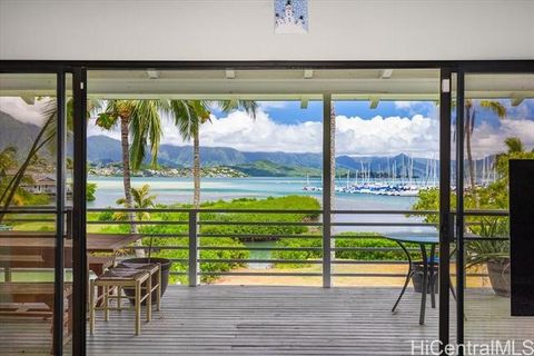 Embrace the allure of this exceptional waterfront property offering breathtaking panoramic views of Kaneohe Bay and the majestic Koolau Range, all situated on nearly 1.5 acres of R-10 zoned land. Boasting over 450 feet of ocean frontage with deep wat...