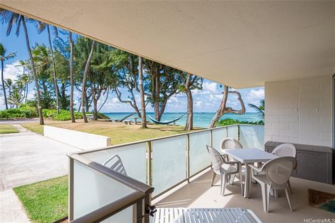 Discover the ultimate beachfront living with this rare 2-bedroom condo in beautiful Punaluu, one of only two in the building and priced at half the cost of other similar Oahu beachfront properties. Completely renovated from the studs, this move-in-re...