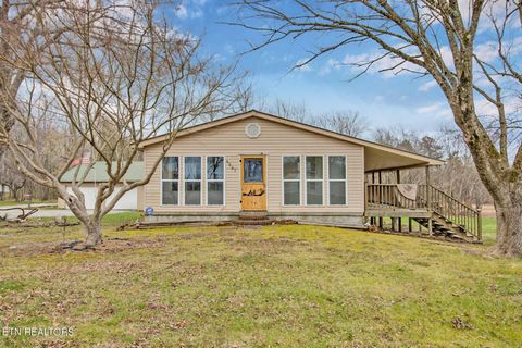 Located in the charming town of Clarkrange, TN, this delightful home offers a perfect blend of comfort and style. Boasting 2 bedrooms and 2 baths, this property is ideal for those seeking a cozy retreat or a starter home. Upon arriving, you'll be gre...