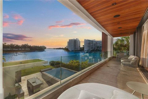 BRAND NEW 2023 CONSTRUCTION! Extraordinary luxurious villa in exclusive Surfside. Modern tropical design with 25 ft waterfall wall upon entrance, double height ceiling lobby, open floor plan living with telescopic doors providing indoor/outdoor enter...