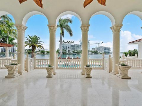 PRESTIGIOUS GATED COMMUNITY OF BAL HARBOUR VILLAGE!!! 100 FEET OF EXCLUSIVE WATERFRONT IN A 20,900 SQ FT LOT, OPEN VIEWS, ACCESS TO THE OCEAN, HOUSE IS OVER 7,000 SQ FT, HIGH 20 FEET CEILINGS, 3 CAR GARAGE, 5 BEDROOMS PLUS STATE OF THE ART LIBRARY, D...