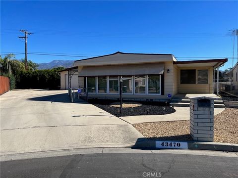 Welcome to 43470 Peace Circle, a charming manufactured home located in Hemet, CA. This 2-bedroom, 2-bathroom home boasts a comfortable and spacious 1,680 square feet of living space, all conveniently situated on a generous 6,970 square foot lot at th...