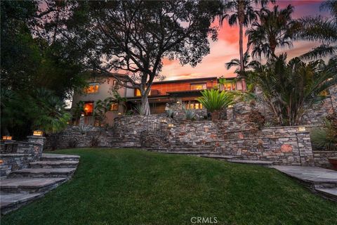 Originally built in 1927, this one-of-a-kind San Marino estate elegantly sits on over an acre of hilltop land with scenic views. The expansive terraced grounds are surrounded by gorgeous, matured trees, gardens and landscaping. A graceful stone walkw...