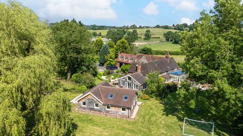 Nestled on the outskirts of the idyllic village of Lowsonford, this exquisite home epitomises countryside charm sitting in approximately 12.5 Acres. This property offers privacy and tranquillity. A cobblestone roundel and wisteria-framed entrance gre...