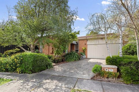 Elevated on the high side of the street, and positioned within an enviably peaceful family neighbourhood, this single level home is privately framed by lush established gardens. Boasting two separate living areas, an ensuite master bedroom, and a sec...