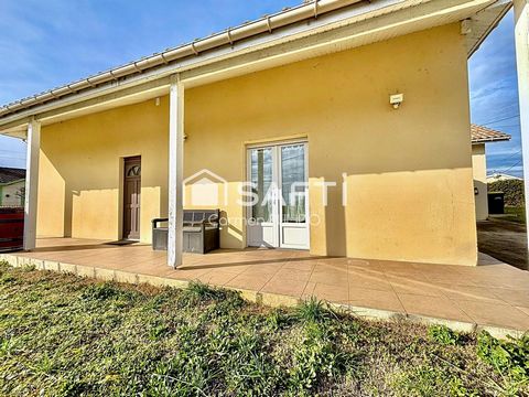 Maison en pierre rénovée : 4 chambres avec jardin et garage.