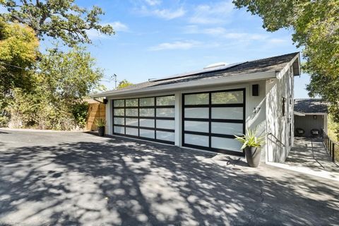 Originally built in 1982 & thoughtfully enhanced over the years, this modern & eclectic Palomar Park home offers incredible custom details & breathtaking views; a true entertainer's dream. Custom kitchen with Thermador gas range overlooking the dinin...