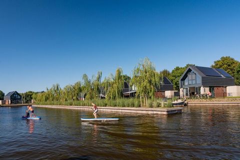 This luxurious holiday home with its own jetty in Balk, Frisian, is very suitable for holidays with the family. The house is located on a small-scale villa park with a direct connection to the Frisian Slotermeer. The water villa has a spacious living...
