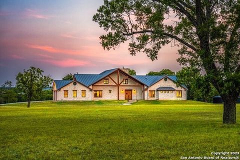 Nestled within the Hill Country, Zanzenberg River Lodge graces 29.52 acres, presenting an expansive 1700' of serene Guadalupe River frontage. The cornerstone of the estate is a majestic 4,450 sf stone home topped with a durable standing seam metal ro...