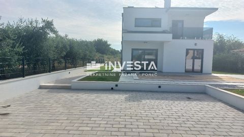 Modern villa near Poreč with sea view Property Description: In a small settlement near Poreč, just 6 km from the city center, this exceptional modern villa is situated with a total area of 139.30 m² on a plot of 521 m². The villa spans two floors, th...