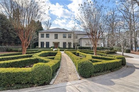 Beautifully designed custom home in Buckhead, situated on a private 1.11 -acre lot. This stunning modern-transitional residence was designed by architects, Harrison Design and finished in 2008. Built to last, this home features exterior insulated con...