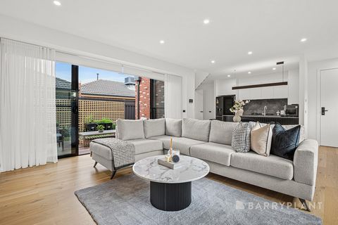 Meticulously crafted, exuding modern sophistication and low maintenance appeal, this contemporary three bedroom, two bathroom residence features luxurious design, family proportions, quality inclusions, and is conveniently zoned to Strathmore Seconda...