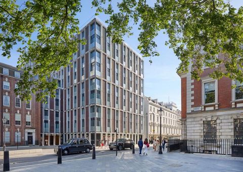 This exquisitely designed apartment offers refined living within one of Mayfair's most architecturally striking buildings. Set across 1,272 sq ft, the home features an open-plan kitchen, dining, and reception area framed by floor-to-ceiling windows a...