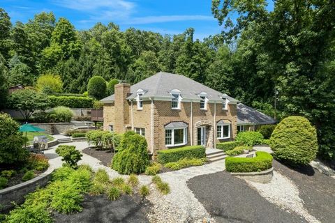 Welcome to your dream home! This exquisite center-hall Colonial, beautifully crafted from classic brick, is nestled on five picturesque acres, offering breathtaking views and ultimate privacy. Inside, you'll find three spacious bedrooms and 2.2 bathr...