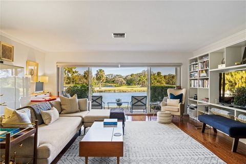 Lake & Golf Front views from this fabulous townhouse, just steps away from the prestigious Moorings Yacht & Country Club! This property has a transferable Club Level Membership available with purchase & approval. Features include 2 balconies for sunr...