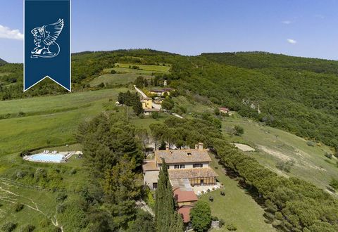 This staggering farmstead for sale is situated in Monte Santa Maria Tiberina and surrounded by the Umbrian hills of the province of Perugia. The estate comprehends seven buildings with ten apartments in total. Their overall internal surface sprawls o...