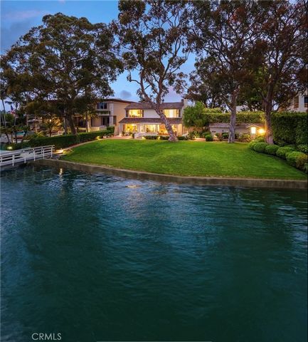 Lying on the westerly side of Harbor Island, Newport Harbor's most revered and sought-after private island locale, this stately period home has been lovingly kept for nearly one hundred years. Held by generations of one family for nearly as long, thi...