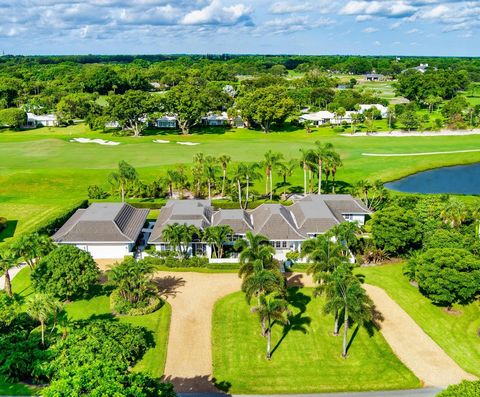 RENOVATED ESTATE WITH GUEST HOUSE is just a short drive to DELRAY BEACHS FAMED ATLANTIC AVENUE; Bermuda-inspired 6 Bed/6.1 bath RENOVATED estate, including a 1,000 sq. ft. 2 Bed/2 Bath Guest House, on sprawling 1 +/- acre site with golf/water views i...