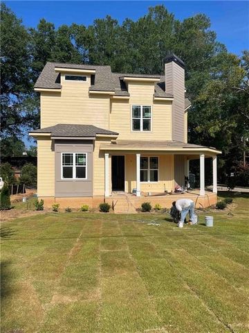 Step back in time with the rekindled charm of this uniquely authentic modernized 1930's two-story arts and crafts style home on a raised slab foundation, located in the walkable heart of historic downtown Austell. This 3-bed 2-bath home features a ma...