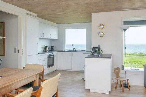 Holiday home located in the first row with direct access to the good bathing beach at Dyngby Strand. The cottage is located high, which gives a fantastic panoramic view of Aarhus Bay. The living room has a large panoramic window, so you can enjoy the...