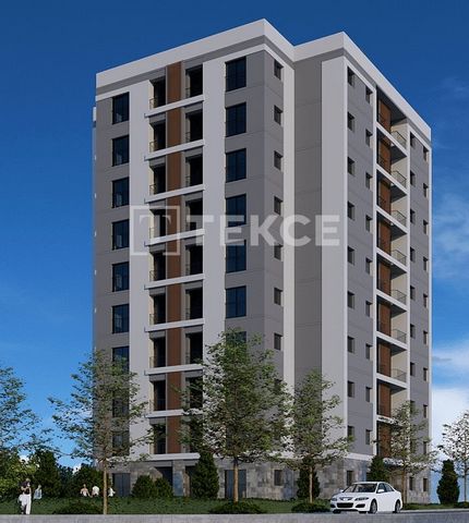 Nieuwe Appartementen op Loopafstand van Alle Dagelijkse Voorzieningen in Bayraklı, İzmir Deze appartementen liggen dicht bij de hoofdweg in Bayraklı, een van de meest sociale en cultureel levendige wijken van İzmir. Bayraklı staat bekend om zijn mode...