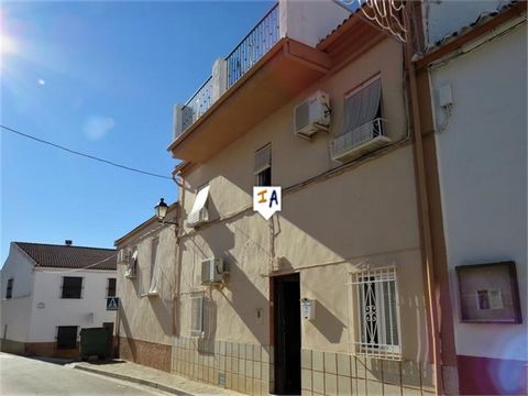 This ready to go furnished house in the village of La Carrasca, Jaen offers ample accommodation. With 5 bedrooms, one with en suite, two or three sitting rooms and a big roof terrace with reservoir views it would make an ideal holiday home or for per...