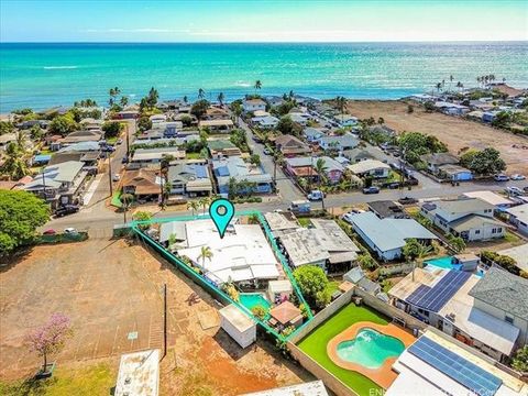 Large 7,971 sq ft of land , This Ewa Beach Home offers a variety of possibilities due to its zoning as R-5, allowing for multi-family living. The main home features 4 bedrooms and 2 full bathrooms, with an expansive living room that has high open bea...