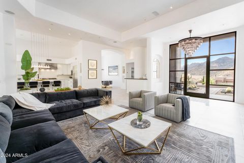 Welcome to the Troon Mountain Treasure! Wake up to breathtaking mountain views and majestic boulders in this meticulously remodeled custom home. Nestled within the prestigious Troon Village, it offers the perfect blend of contemporary design & serene...