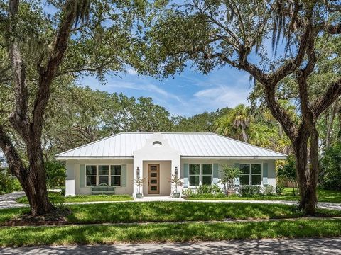 Coveted Central Beach Location! Majestic Oaks perfectly frame entry & circular driveway. Luxurious coastal designed 3BR/3.5BA home w/spa like features. Easterly & southern sun pours into the house. East sun bathes the salt water pool & lanai. Concret...