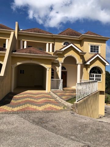 Spacious 2 bedroom 2 and a 1/2 bathroom town house with well lit comfortably sized rooms, large windows, balconies and patios throughout the unit, a single car carport and a sizable back yard, located in gated community with 24 hour security, lush gr...
