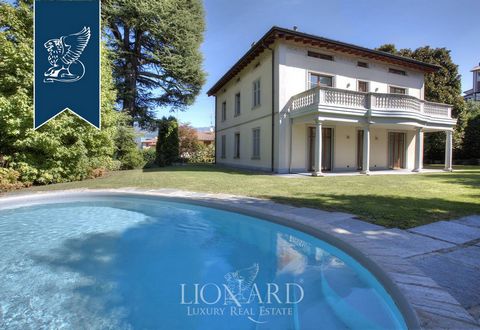 This marvelous villa girdled by nature for is situated in Como and stands at a short distance from the Lake's renowned shores. This estate sprawls over roughly 550 m² and encompasses three floors and a lower-ground floor. A portico with classica...
