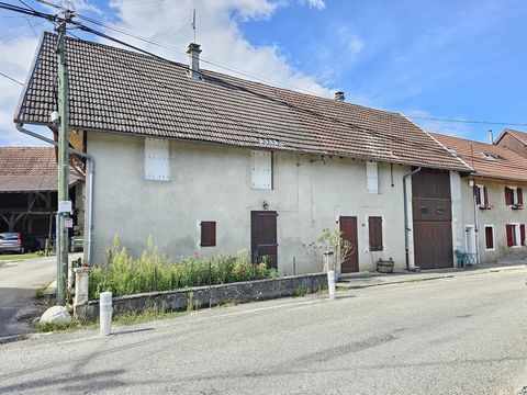In a small hamlet of YENNE, stone house, semi-detached on one side, about 102 m2 with outbuildings. It consists on the ground floor, an entrance hall, a living room, a living room, a bathroom and a toilet. Upstairs, three bedrooms, one of which is th...