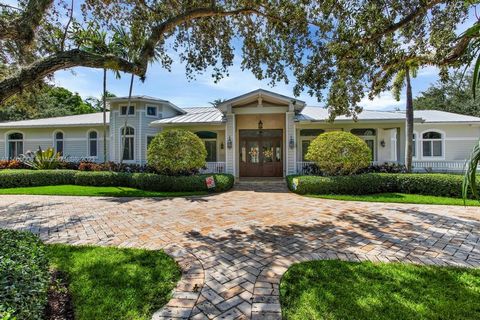 Beautiful Tropical Estate in Pinecrest. This spectacular home sits on a gated 38,768 sq ft lot and boasts 5 bedrooms, 4 full baths, 1 half bath, 2 of the 5 bedrooms are over sized junior suites with walk-in closet and full bathroom, large Office, whi...