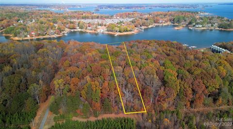 Indulge in true lakeside living on this exceptional buildable 2.3-acre waterfront parcel gracing the Lake Norman shores. Boasting an expansive 256 feet of private shoreline, this acreage offers an unparalleled connection to the water. With near main ...