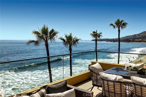 Seize a rare opportunity to own this remarkable 3-bedroom, 3.5-bathroom oceanfront condo in Laguna Beach, where the allure of coastal living meets unmatched panoramic views of the Pacific Ocean. Positioned directly on the sand, oversized windows and ...