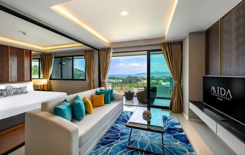 Welcome to the world of luxury and sophistication in Phuket!  We present to your attention a spacious three-bedroom apartment with an area of 107 square meters, just a few steps from the beaches of Bang Tao and Surin. This apartment is located in a m...