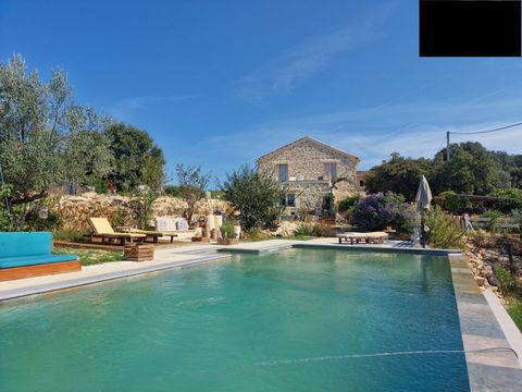 CEZE VALLEY: Near GOUDARGUES: Property of character surrounded by nearly 12 hectares of vines (AOC Cotes du Rhone), olive trees and woods with open views over the hilly landscape of scrub land and vineyards. Consisting of 2 adjoining buildings, this ...