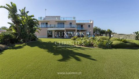 The villa was constructed with a south-facing orientation to maximise the panoramic view of the sea and the Ria. The office/library is located in the atrium , followed by the music room and a social area that provides access to the living room with d...