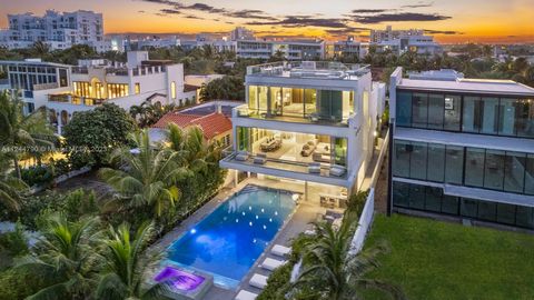 Stunning new modern construction estate in the esteemed gated Oceanfront community, Altos Del Mar. This 7 bedroom, 9.5 bathroom tri-level smart-home boasts unrivaled views of sunsets and the Atlantic Ocean. Luxury features include a private elevator,...