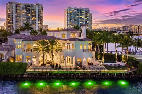 Experience sophisticated island living in this stunning waterfront paradise. This exceptional tri-level home offers 5 bedrooms, each with its own waterfront balcony, 6 bathrooms, and 2 half baths. With an elegant combination of marble and walnut wood...