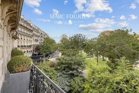PARIS XIV. In a luxury Haussmann building with caretaker, on the 2nd floor (elevator), air-conditioned apartment completely renovated with high quality services. It includes an entrance gallery, a double living room, a wood paneled dining room openin...