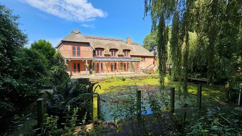 Down a private stretch of river with a generous mooring, you’ll find this waterside family abode. A modern home with real charm and character, beautifully thatched and hidden from the road. With an abundance of wildlife and gorgeous gardens, the sett...