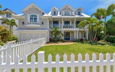 Welcome to your island oasis! This stunning modern waterfront home redefines relaxation. Step through the double front doors and behold the tropical backyard. Ascend to the main living level via custom handrail-adorned stairs or the convenient elevat...