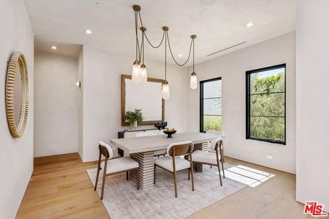 Presenting a pristine, newly constructed residence nestled South of the Boulevard in the highly coveted Longridge Estates pocket of Studio City. This exquisite 5BD/6.5BA estate, built and designed by Abode Homes, epitomizes elegance with its lavish f...