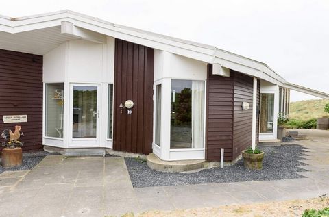 Untraditionally architect-designed cottage from the 80's. This cottage is located in the first dune row next to the North Sea and has everything in modern conveniences. There are several fireplaces in the centrally located chimney, large spa for 4 pe...
