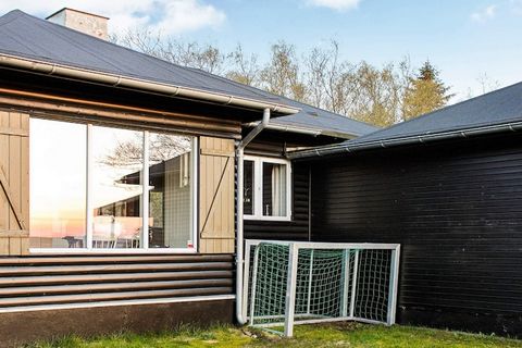 Cottage on large natural plot with lots of trees and only approx. 200 m to the Limfjord. From the ground there is a fantastic view over the Limfjord towards Sallingsund and Mors. Large activity room with table football, darts and game console. The co...