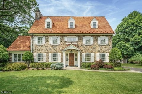 Situated on nearly an acre in Old Short Hills, this timeless fieldstone Colonial offers a rare balance of architectural significance and livability. From its classic facade to elegant proportions, the home invites you in with presence and warmth. Ins...